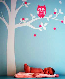 Tree decal with an owl on the branch of a baby nursery wall