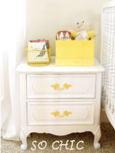 A recycled night stand with bright yellow, painted drawer pulls makes a lovely addition to a baby girl's vintage nursery or shabby chic nursery