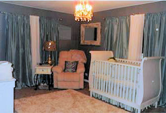 A beautiful baby boy nursery room decorated in a vintage cars theme and sea green and white color scheme