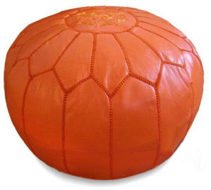 Orange Moroccan pouf ottoman for a baby nursery room