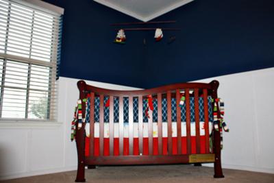 The red, white and blue nautical baby bedding that the baby's grandmother made!