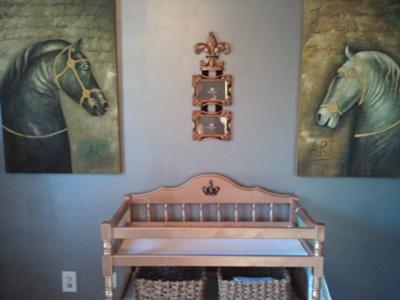 The baby's changing table was customized with gold metallic paint and the nursery walls are painted with silver metallic Martha Stewart precious metals paint. 