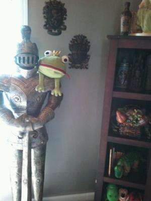 This isn't a frog prince nursery theme but the stuffed, green frog on the shoulder of the knight's armor adds a whimsical touch to the decor.