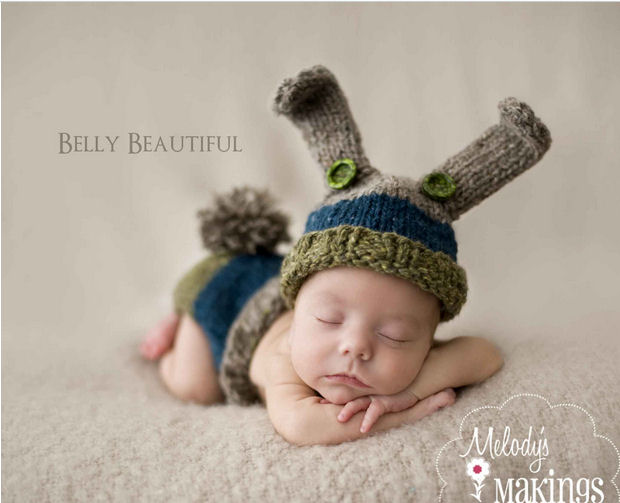Baby diaper cover and bunny ears knitting pattern with pom poms and bunny rabbit ears for spring Easter or baby first portrait photo shoot.