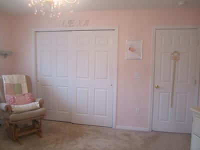 Letters over the nursery closet spell our little princess' name