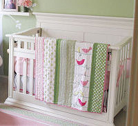 Pink and green baby crib quilt with bird applique patterns
