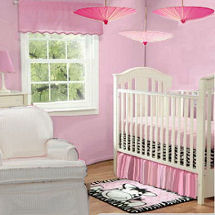 Pink girl zebra baby nursery theme room decorated in an umbrella theme