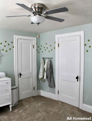 Gender neutral nursery room decorated with polka dots for a baby boy