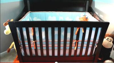 Baby boy crib bedding set with jungle animals on the bumper pad perfect for a safari nursery theme