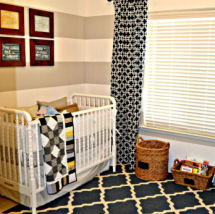 Modern baby boy nursery with black white khaki and gray crib bedding and curtains