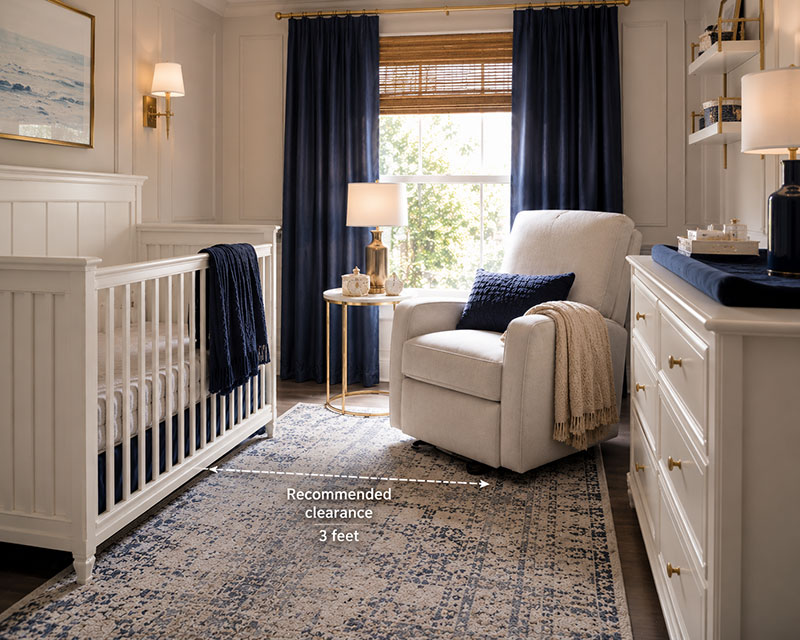 High end nursery showing proper spacing between crib and recliner
