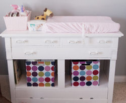 Fabric baby nursery storage bins with large polka dots in bright colors