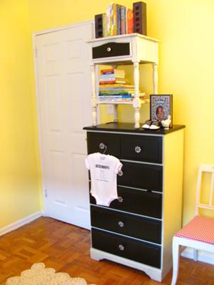 I painted the vintage nursery dresser in black and white and then updated the drawer pulls.  It looks amazing with the baby's yellow nursery walls.