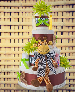 Jungle safari baby shower diaper cake centerpiece for a girl in pink and zebra print with toy giraffe decorations