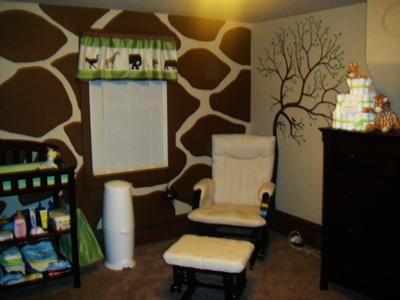 The baby's green, brown, white, and tan safari crib bedding set determined the color scheme and theme for the room.