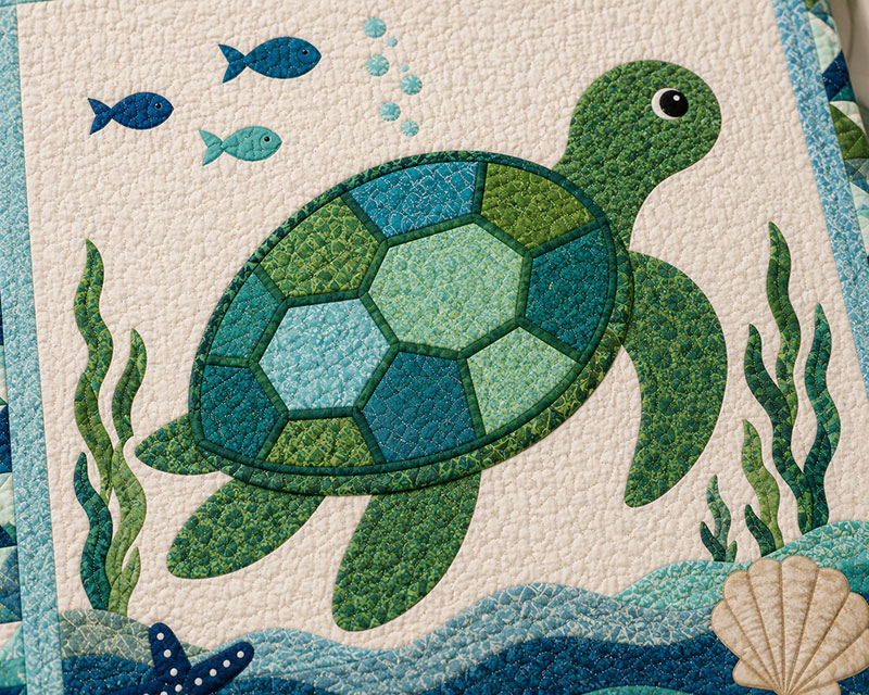Closeup of sea turtle quilt shell detail and quilting stitches