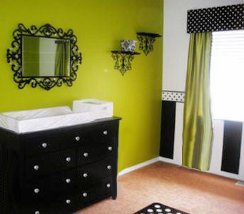 Black and white stripes painted with a polka dot border in a baby girl nursery