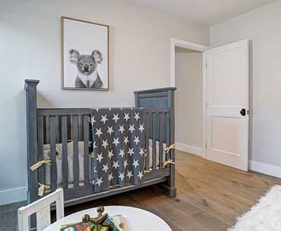 Neutral Koala bear baby nursery with star crib quilt