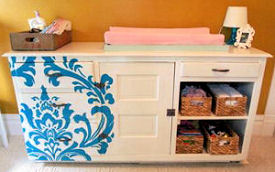 Baby changer dresser painted using a large damask stencil pattern