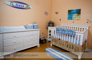 Surf nursery theme with personalized surfboard wall decals baby blue bedding and raffia crib skirt