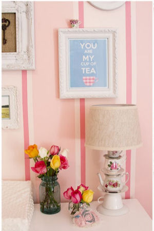 Vintage style topsy turvy stacked teacups and saucers lamp in a pretty pink teacup theme baby girl nursery room