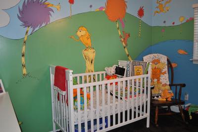 The baby's nursery is based on the Lorax Dr Seuss nursery