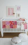 Allegra's modern baby girl nursery decorated in pink white and gray with metallic silver accents