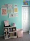 Baby nursery wall art arrangment.  The white picture frames look so clean on the aqua wall paint.