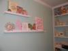 Wall shelves with decorations from previous nurseries and my own room when I was little.  I made the pink letter 