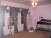 A view of our baby girl's pink and black nursery and her chandelier
