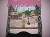 A custom painting for our baby girl's nursery room features a view of a street in Paris