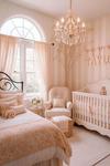 Pretty pink butterfly nursery decor in a shared room