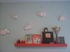 Orange wooden display shelf made by dad with paper mache clouds