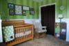 Green and brown elephant nursery with striped walls