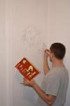 Dad making sketches of our favorite Dr. Seuss illustrations on the nursery wall