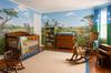Jonas' safari nursery theme wall mural with paintings of a Giraffe, Zebra, Monkeys and a friendly lion and tiger or two!
