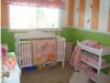 Light n airy lime green and orange baby nursery room design