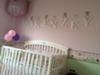 The upper portion of our baby girl's nursery wall is bubblegum pink is separated from the lower third  painted in fresh spring green by a cute ladybug wallpaper border
