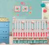 Modern Pink and Turquoise Baby Girl Nursery with Painted Turquoise Blue Dresser and Tissue Paper Pouf Ceiling Mobile