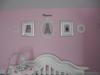 An arrangement of wall decorations in a baby girl's pretty pink princess nursery 