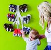 The Boon Baby Shoe Rack looks amazing on the nursery wall!  All the more reason not to hold back on buying as many cute booties as mom wants!
