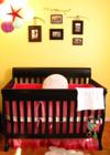 Gender neutral Rustic Chic and Cheeky Nursery Decor.  The tree branches give the wall arrangement of photos a distinctly rustic but sophisticated appearance.