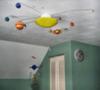 Solar System Ceiling Light with Revolving Planets for a Planet Baby Nursery or Kids' Room Theme