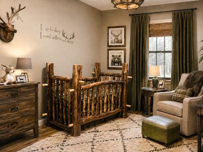 An enchanting hunting baby nursery theme with a natural wood crib made by dad using reclaimed wood from the forest where he and Jace's mom hunt.  