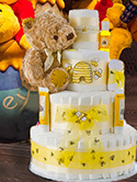 Winnie the Pooh Bear baby diaper cake for a baby shower centerpiece