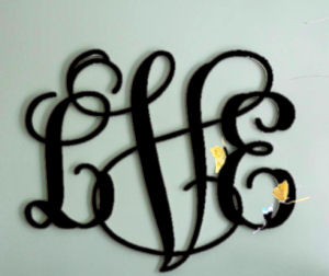 Round wood wall monogram for a baby boy nursery