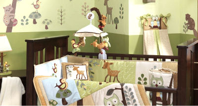 Baby crib bedding set featuring woodland creatures deer owl squirrels bird raccoons and mushrooms in a forest with trees