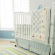 Baby blue and white sailboat nautical theme nursery room for a boy