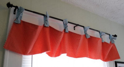 Red and blue homemade tie-top nursery window valance