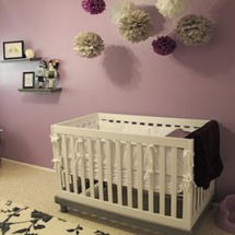 Purple and black baby girl nursery with a modern tattoo theme